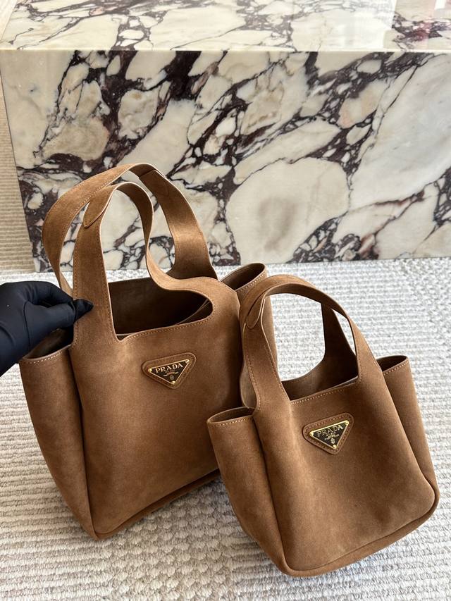 170 Prada's chic basket bag is a key piece in the collection and will be a mains