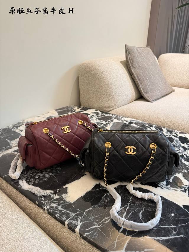 Chanel 25K pebbled leather black bowling bag. The pebbled leather bowling bag wi