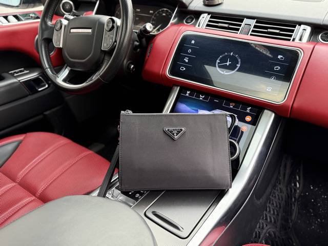 High-end latest "Prada" clutch bag. Features the Prada logo, adjustable shoulder