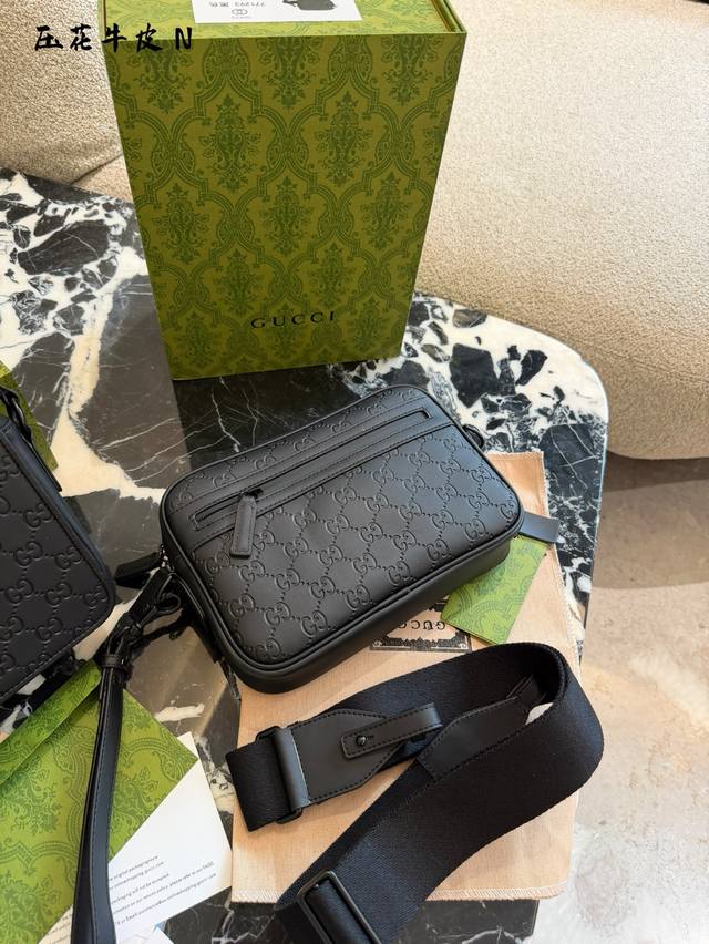 Gucci GG series crossbody bag, black rubber-effect leather with classic GG embos