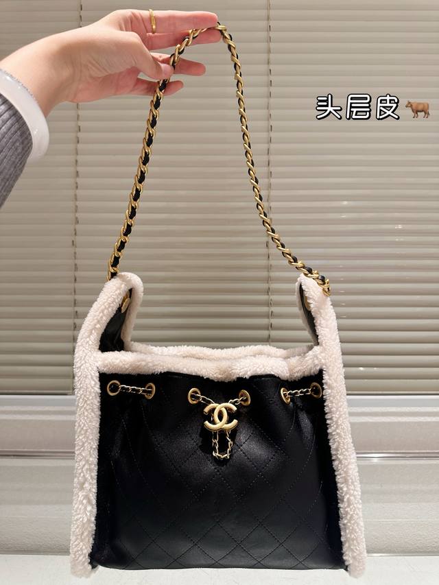 Original single-piece top-grain leather Chanel 25C suede drawstring hippie bag.