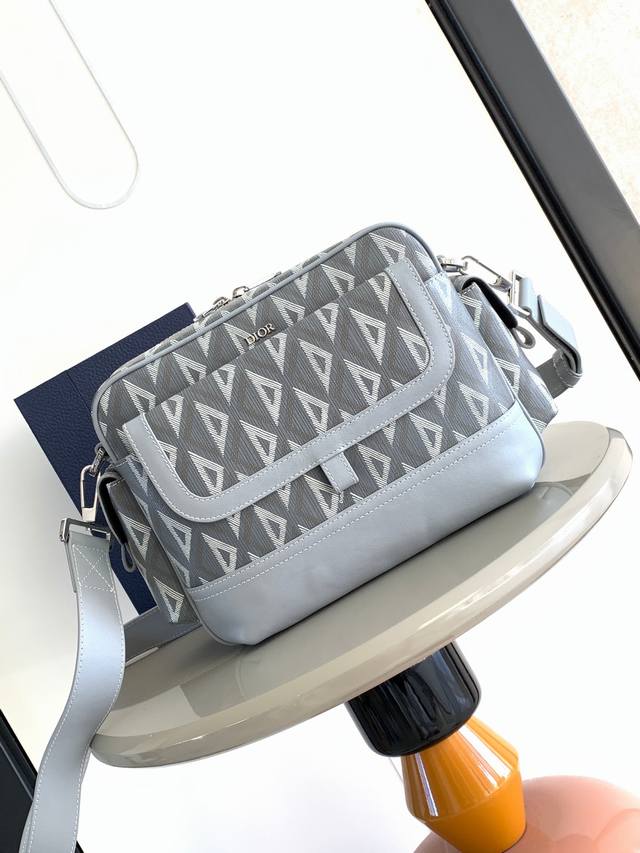 Original Background. This Dior Hit The Road messenger bag is a new addition to