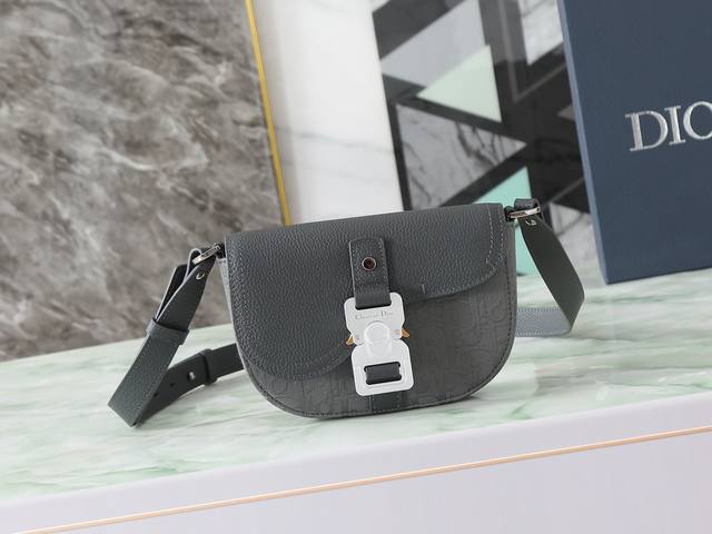 This saddle clutch with a shoulder strap is a new piece from the Spring 2023 me