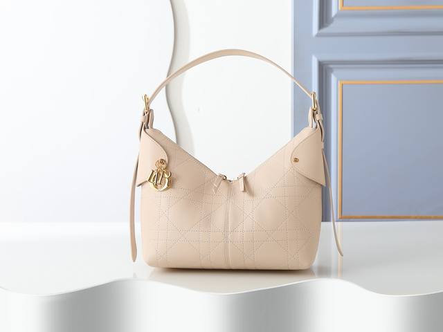 Style No. 2846 Medium Rouge Beige Dior Voyage handbag is crafted from beige ple