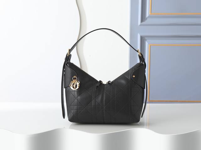 Style No. 2846 Medium Black Dior Voyage Handbag is crafted from black pleated c