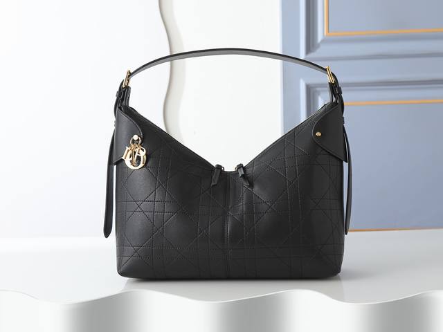 Style No. 2847 Large Black Dior Voyage Handbag is crafted from black pleated ca