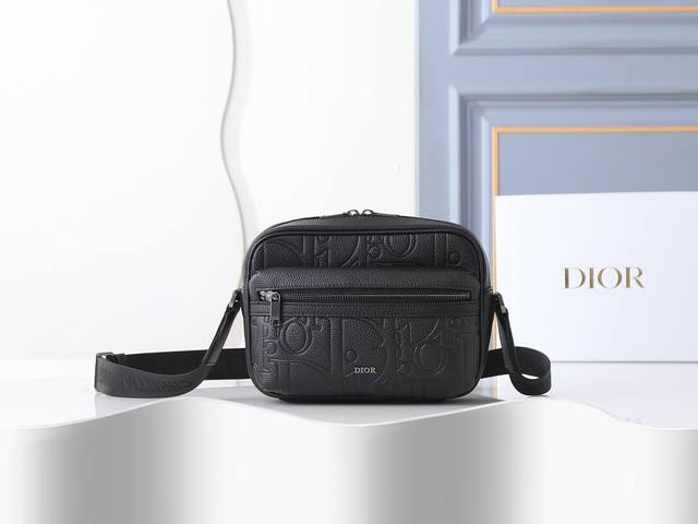 Style No. 0 Black embossed zip-up messenger bag, with tonal calfskin leather de