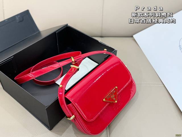 Prada ( ) This one is so cute! The big triangular logo is so classic! The price