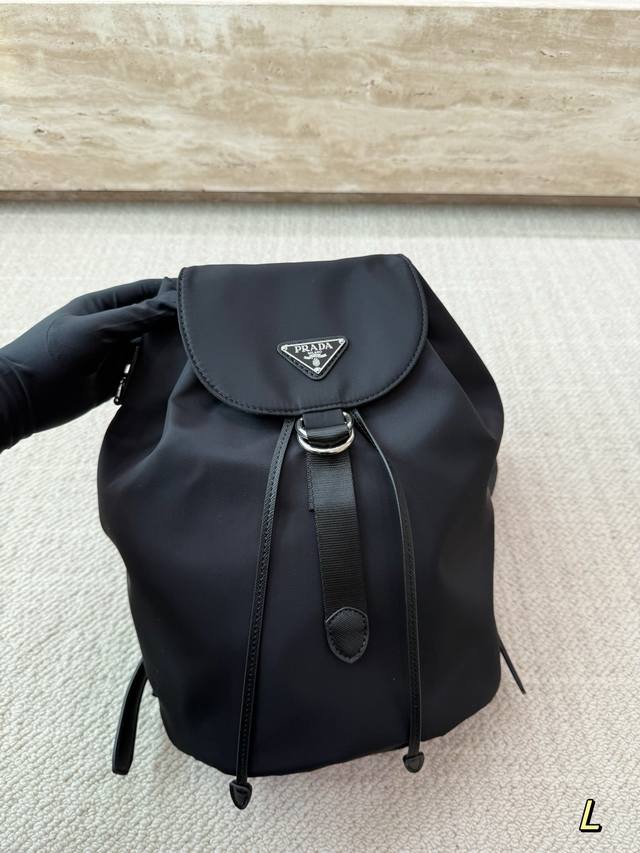 Prada Nylon Drawstring Backpack ( ) This Prada nylon drawstring backpack is mad