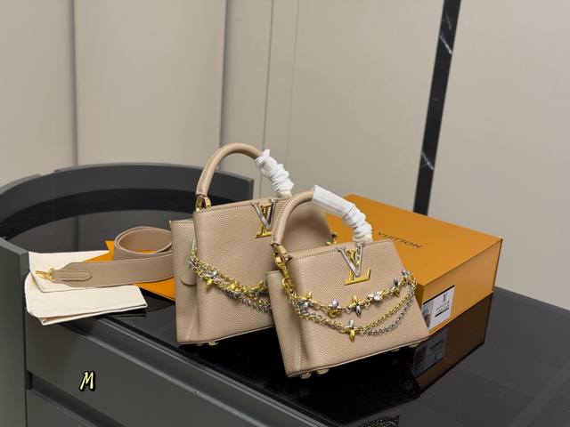 Comes with a folding box. Size: 21.15cm x 27.18cm. LV Capucines handbag. Made o