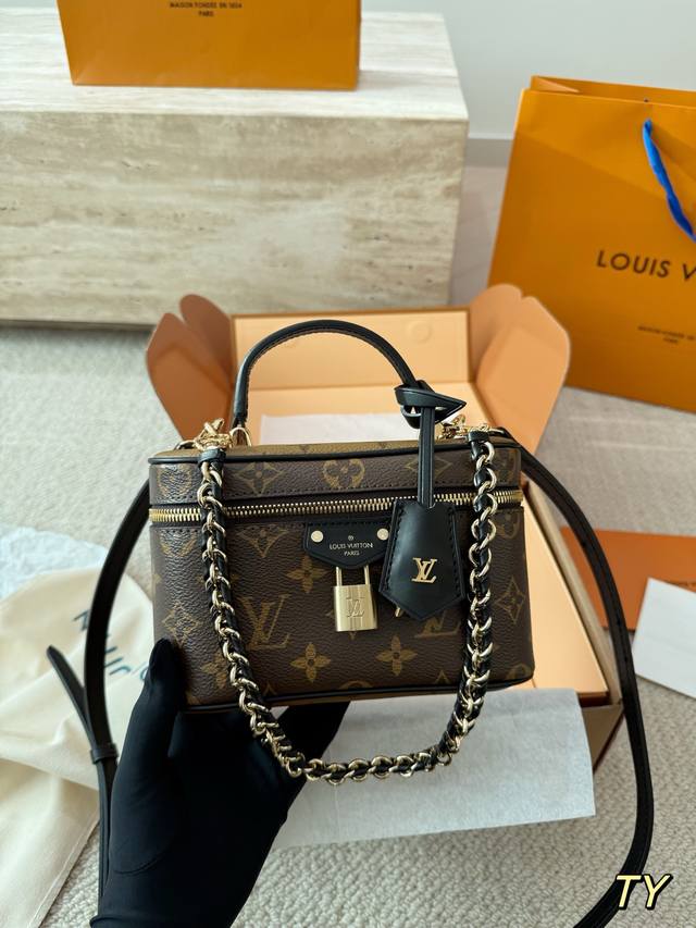 Leather version of the Louis Vuitton Vanite Trunk handbag. Inspired by a travel