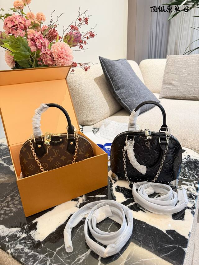 LV Alma Trunk Bb Handbag The LV Alma Trunk Bb handbag features classic Monogram